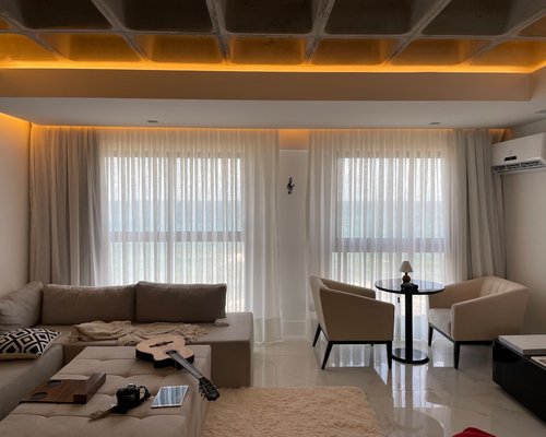 Natural sunlight gently filtering through sheer curtains in a modern apartment
